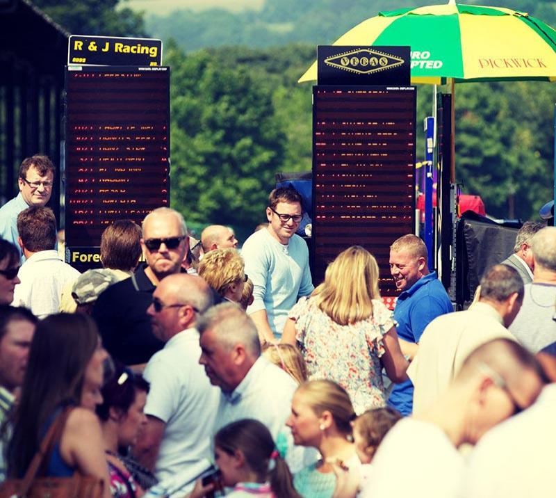 Crowds gathered around bookmaker stands.