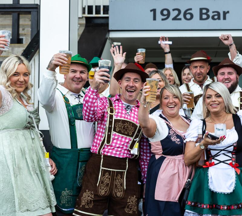 A large group of friends in fancy dress at Chepstow Races