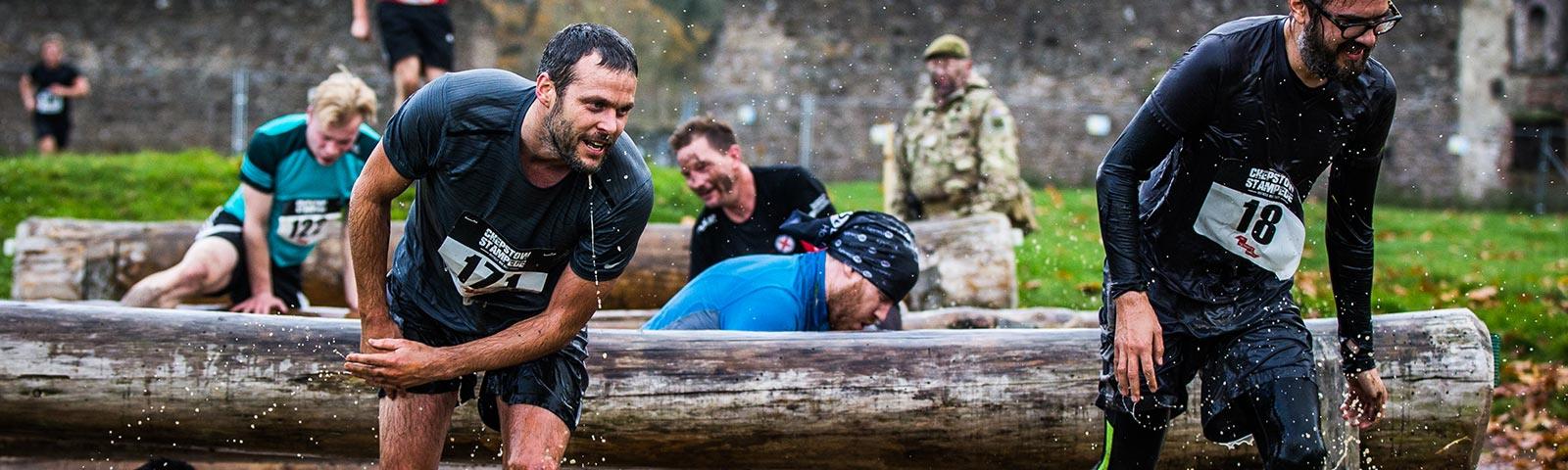A group of soaked contestants tackle several water based obstacles.