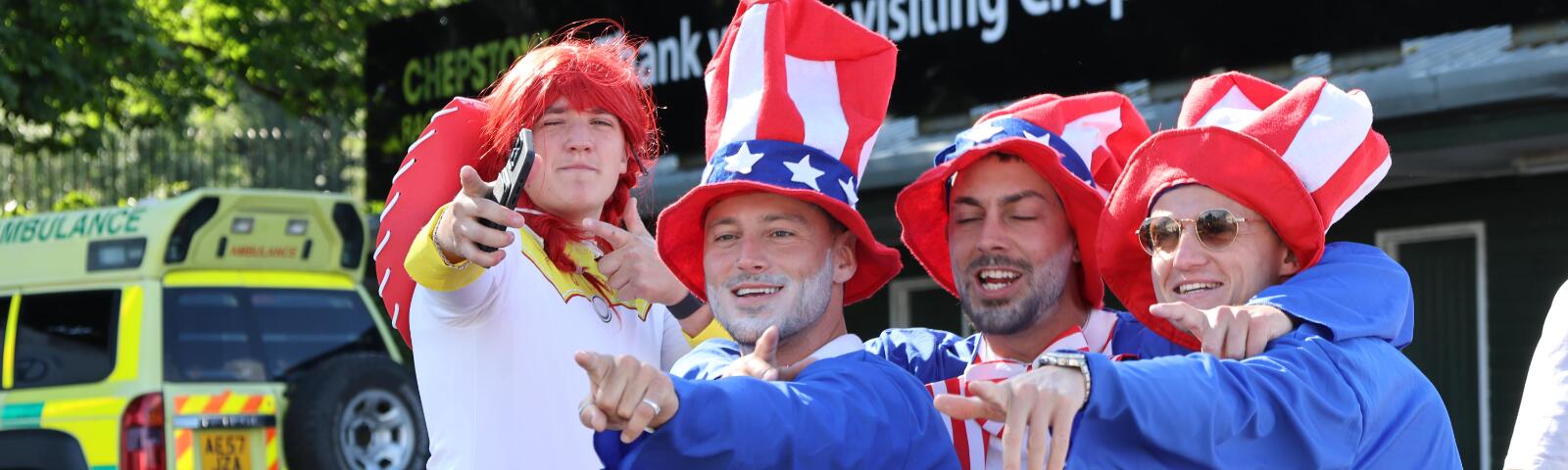 A group of guys in fancy dress at Chepstow Races